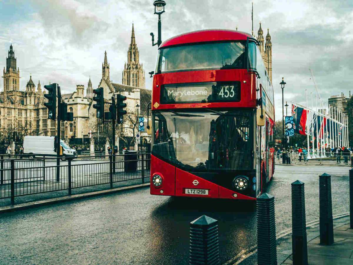 A-classic-red-double-decker-bus-passing-by-famous-landmarks-1.jpg