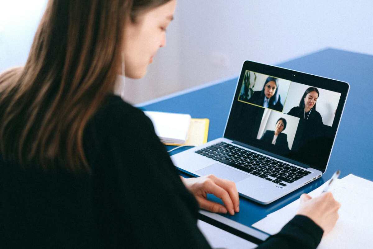 A-woman-engaging-in-a-video-conference-using-a-laptop-at-hom1.jpg