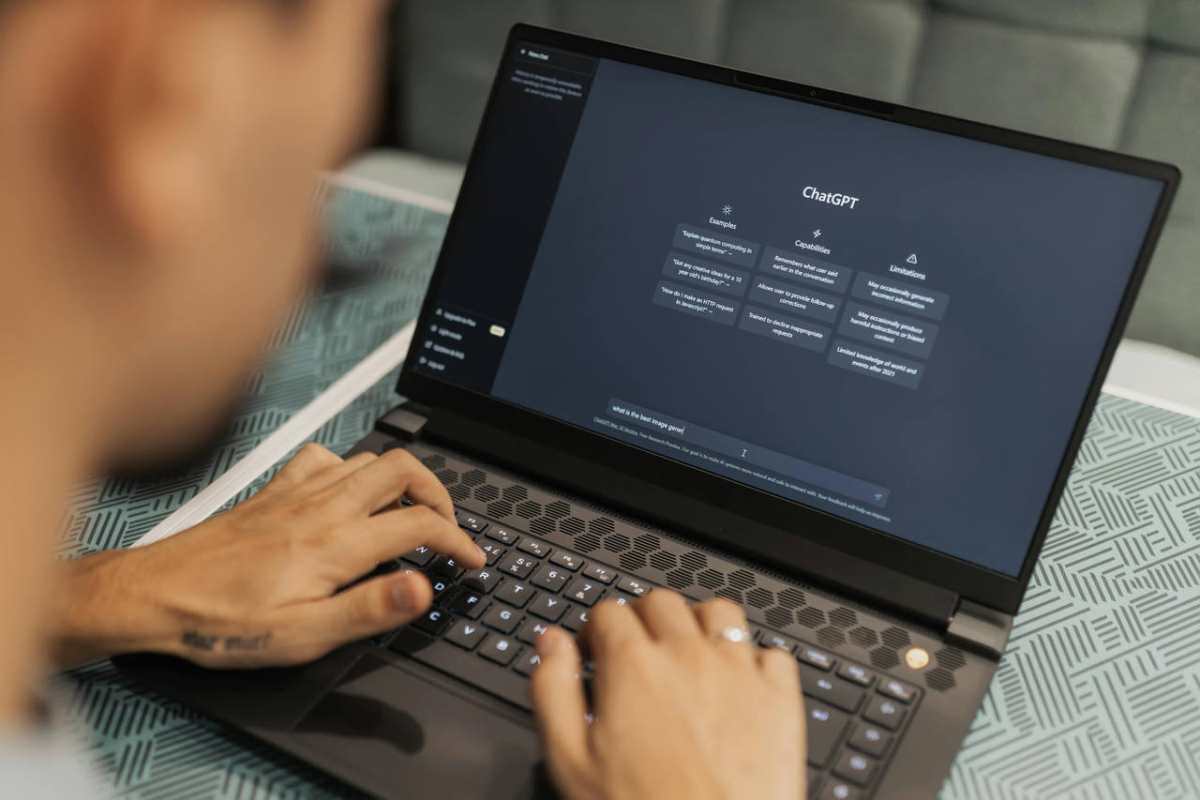 Close-up-of-a-person-typing-on-a-laptop-displaying-the-ChatG1.jpg