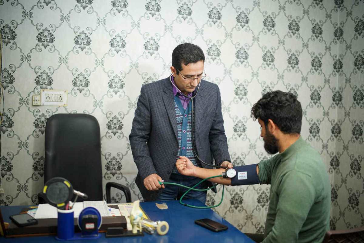 Doctor-checking-patient-s-blood-pressure-during-medical-cons1.jpg