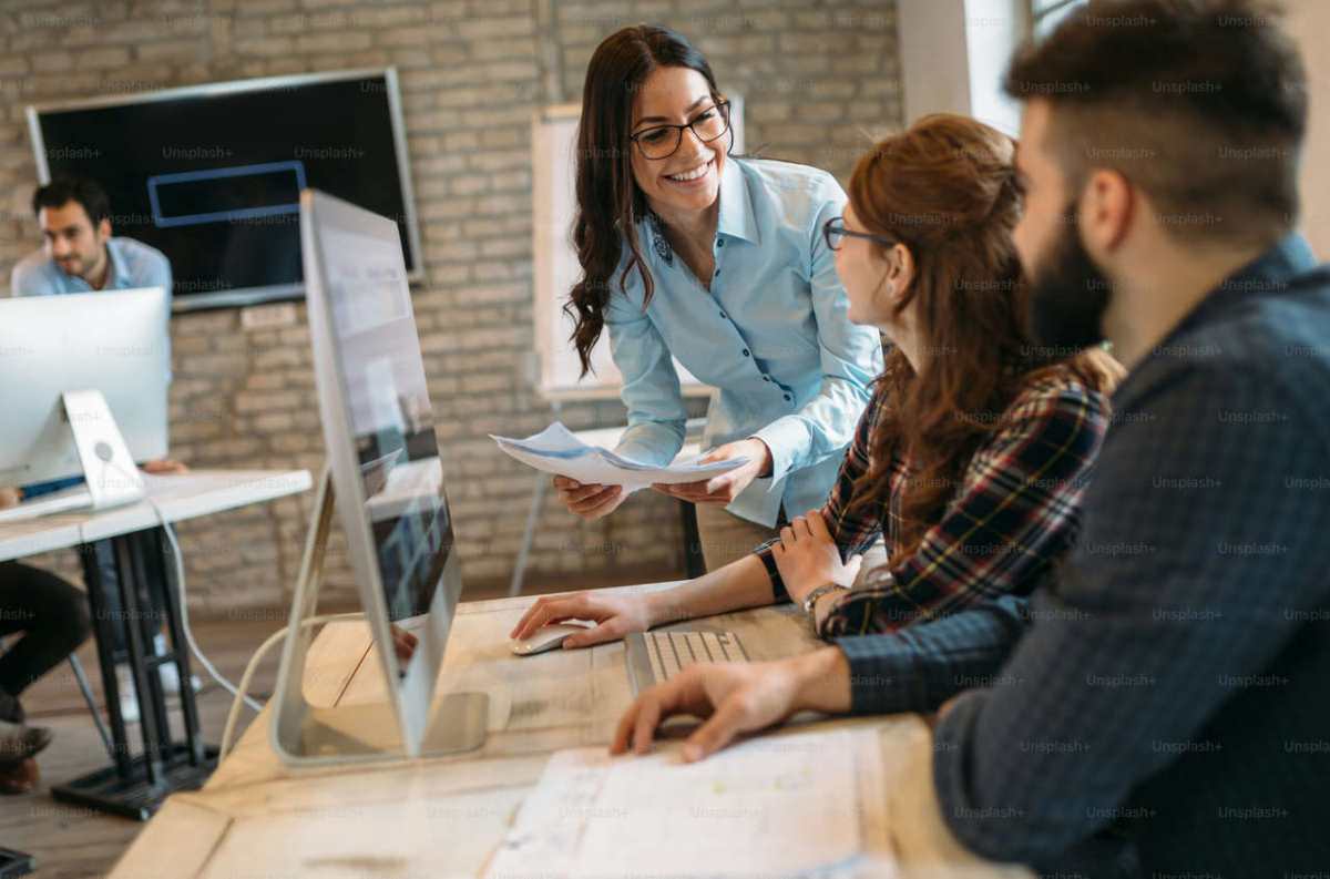Happy-creative-coworkers-working-in-designer-office1.jpg