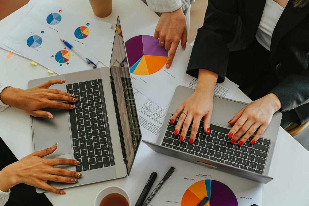 Top-view-of-women-working-together-on-laptops-with-business-1.jpg