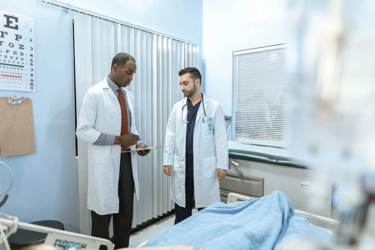 Two-doctors-review-a-patient-s-chart-in-a-hospital-room-foc1.jpg