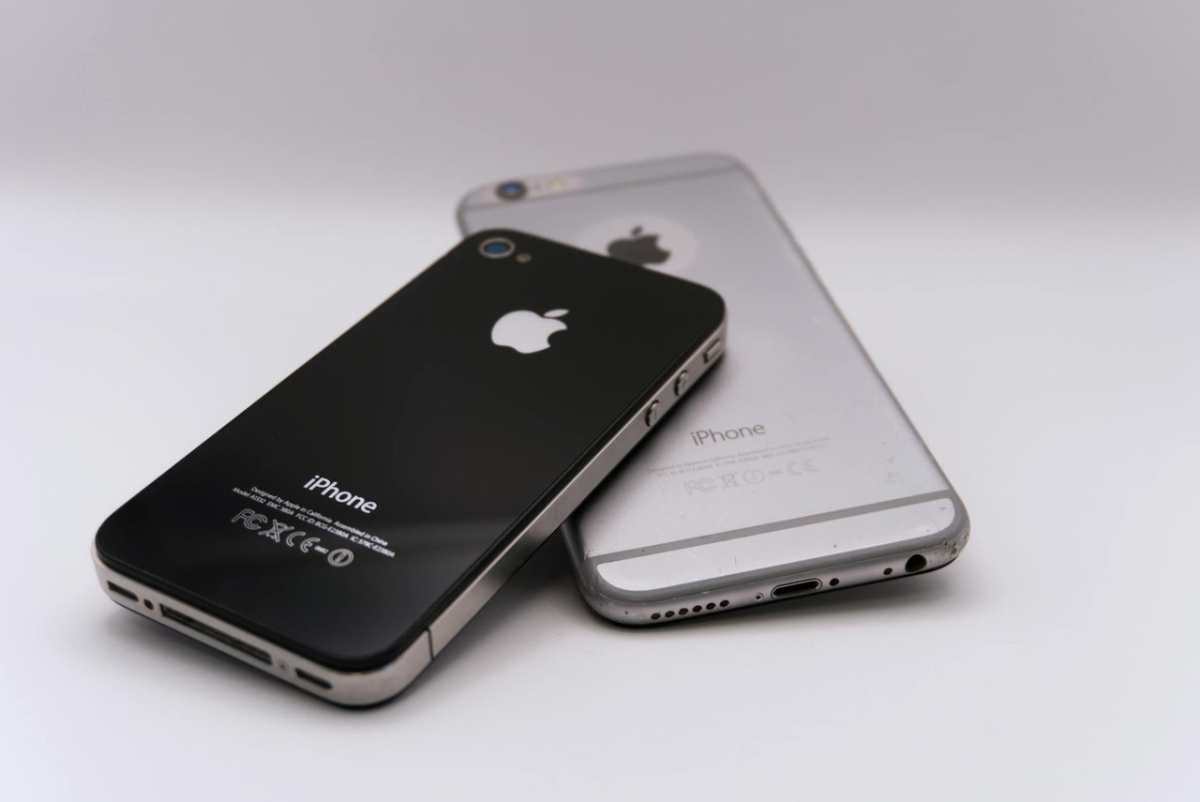 Two smartphones displayed on a white surface, showcasing modern technology.
