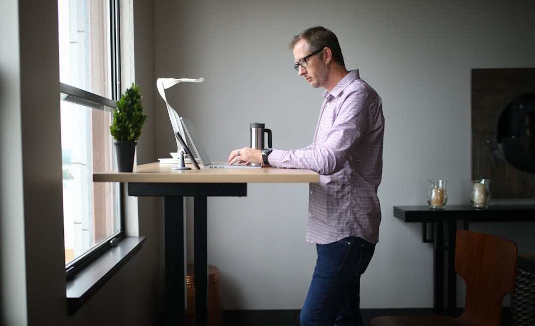 man-in-pink-dress-shirt-and-blue-denim-jeans-standing-beside.jpg