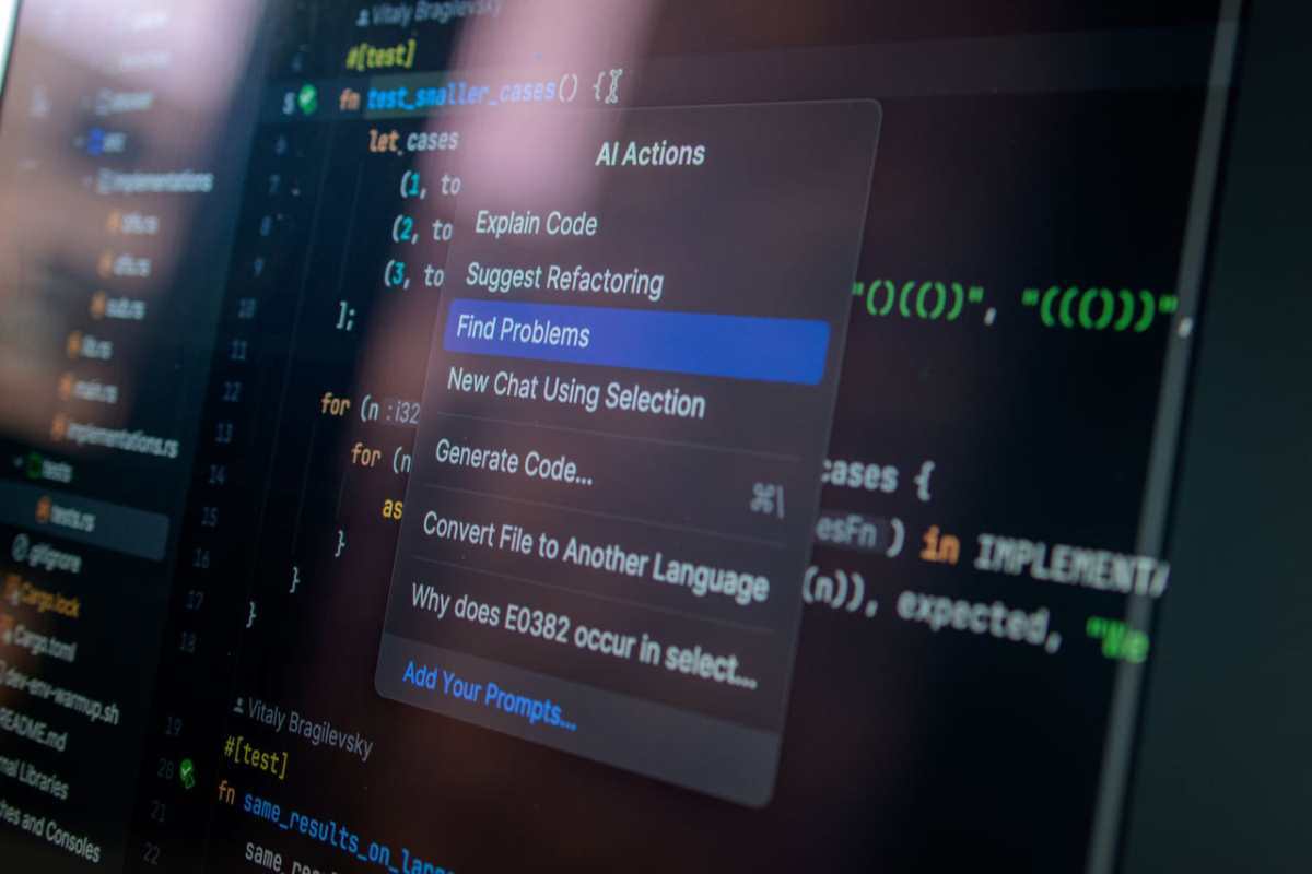 Detailed view of a computer screen displaying code with a menu of AI actions, illustrating modern software development.