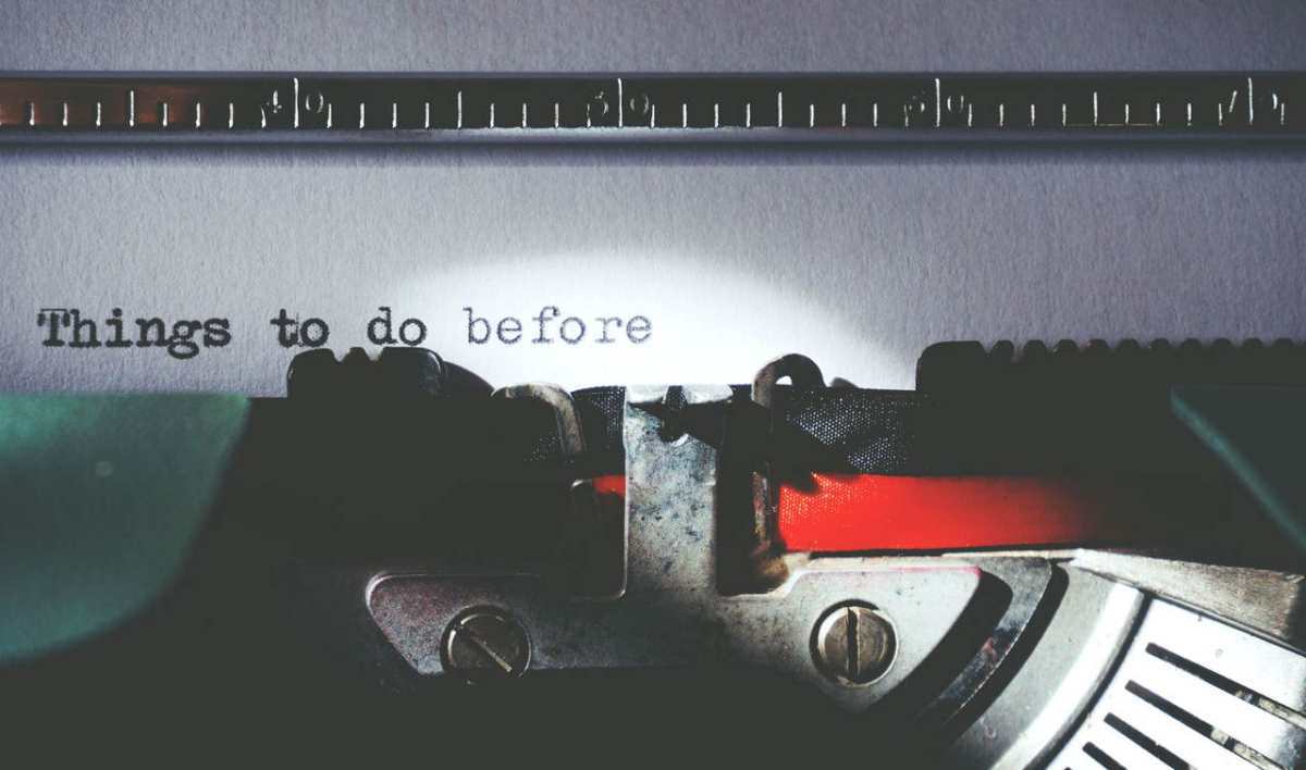 Close-up of a vintage typewriter typing 'Things to do before'.