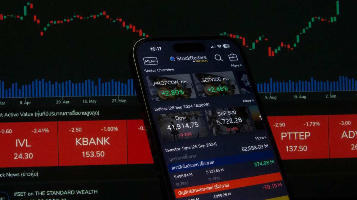 Close-up of a digital stock trading app interface with investment charts and market trends displayed.