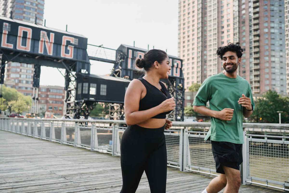 Two people jogging outdoors in Long Island City, enjoying a healthy lifestyle and sports activity.